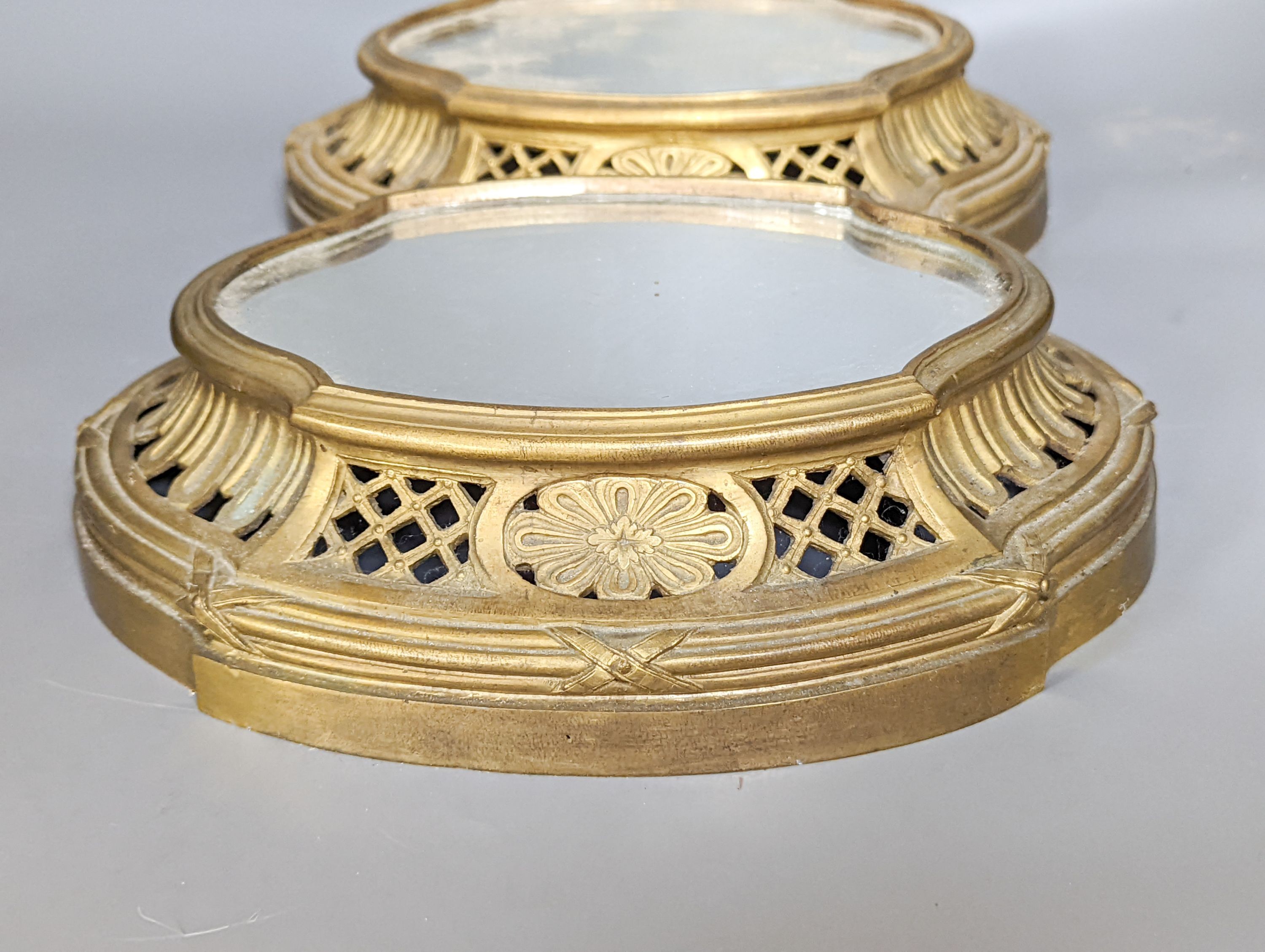 A pair of mirrored ormolu plateaus, 28cm